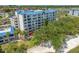 Exterior shot showcasing a multi-story condo building with a view of the adjacent golf course at 2333 Feather Sound Dr # A107, Clearwater, FL 33762