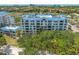 Exterior shot showcasing a multi-story condo building with a view of the surrounding nature at 2333 Feather Sound Dr # A107, Clearwater, FL 33762