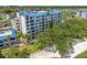 Exterior shot showcasing a multi-story condo building with a view of the adjacent golf course at 2333 Feather Sound Dr # A107, Clearwater, FL 33762