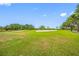 Scenic view of the lush green golf course featuring manicured lawns and mature trees at 2333 Feather Sound Dr # A107, Clearwater, FL 33762