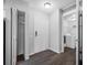 Hallway view with utility closet and laundry area in this residential space at 2333 Feather Sound Dr # A107, Clearwater, FL 33762