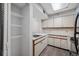 Functional kitchen featuring plentiful cabinets, sink, and laminate flooring at 2333 Feather Sound Dr # A107, Clearwater, FL 33762