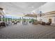 Lounge area with chandelier, neutral colored furniture, and views from the large windows at 2333 Feather Sound Dr # A107, Clearwater, FL 33762