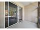 Spacious patio features a screen door and view of landscaping at 2333 Feather Sound Dr # A107, Clearwater, FL 33762