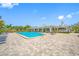 A beautiful pool outside the clubhouse with blue lounge chairs at 2333 Feather Sound Dr # A107, Clearwater, FL 33762