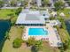 Aerial view of community pool, spa, lounging area, and landscaping at 2333 Feather Sound Dr # A107, Clearwater, FL 33762