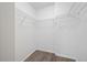 Walk-in closet boasts wire shelving and wood-look flooring at 2333 Feather Sound Dr # A107, Clearwater, FL 33762
