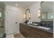 Lavish bathroom showcasing dual sinks with marble counters, ornate mirrors, and elegant fixtures at 2395 Campbell Rd, Clearwater, FL 33765