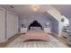 Charming bedroom with lavender walls, twin closets, and stylish decor at 2395 Campbell Rd, Clearwater, FL 33765