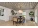 Elegant dining room featuring stylish decor, modern light fixture, hardwood floors, and seating for eight at 2395 Campbell Rd, Clearwater, FL 33765