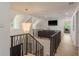 Bright hallway with hardwood floors, decorative lighting, and a view of a comfortable living area at 2395 Campbell Rd, Clearwater, FL 33765