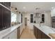 Bright kitchen with marble counters, stainless steel appliances, and dark wood accent cabinets at 2395 Campbell Rd, Clearwater, FL 33765