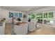 Bright living room with large sectional, wood coffee table, and sliding glass doors leading to the outdoor area at 2395 Campbell Rd, Clearwater, FL 33765