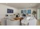 A spacious living room featuring a large sectional sofa, stylish decor, and modern entertainment setup at 2395 Campbell Rd, Clearwater, FL 33765