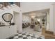 Open-concept living room with a soaring ceiling, stylish furnishings, and a view of the adjacent dining area at 2395 Campbell Rd, Clearwater, FL 33765