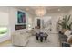 Cozy living room showcasing a fireplace, comfortable seating, and an open doorway leading to the entry hall at 2395 Campbell Rd, Clearwater, FL 33765