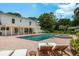 Enjoy the backyard's pool, spa and tanning chairs of this beautiful home at 2395 Campbell Rd, Clearwater, FL 33765