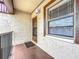 Cozy condo entrance with a private balcony and a view from the window at 2400 Winding Creek Blvd # 14-201, Clearwater, FL 33761