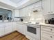 Well-lit kitchen featuring stainless steel appliances and subway tile backsplash at 2400 Winding Creek Blvd # 14-201, Clearwater, FL 33761