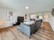 Comfortable living room featuring sleek furnishings, modern art, and bar seating at 2400 Winding Creek Blvd # 14-201, Clearwater, FL 33761