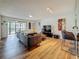 Open-concept living area with sliding glass doors to balcony and modern decor at 2400 Winding Creek Blvd # 14-201, Clearwater, FL 33761