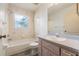 Bathroom with a tub-shower combination and vanity at 2418 Deltona Blvd, Spring Hill, FL 34606