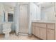 Bathroom featuring a vanity, toilet, and glass enclosed shower at 2418 Deltona Blvd, Spring Hill, FL 34606