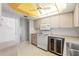 Bright, well-lit kitchen features ample counter space, cabinetry, modern appliances, and an eye-catching ceiling at 2418 Deltona Blvd, Spring Hill, FL 34606