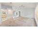 Bright and airy living room with an open floor plan, built in shelving, and ample natural light at 2418 Deltona Blvd, Spring Hill, FL 34606