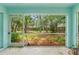 View from screened in patio looking out on backyard at 2418 Deltona Blvd, Spring Hill, FL 34606
