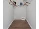 Walk-in closet features wire shelving for optimal organization at 2616 Tottenham Dr, New Port Richey, FL 34655