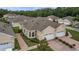 Charming home featuring a two-car garage, brick driveway, and well-manicured landscaping at 2616 Tottenham Dr, New Port Richey, FL 34655