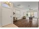 Bright and airy living room featuring hardwood floors, stylish furnishings, and an arched entryway at 2616 Tottenham Dr, New Port Richey, FL 34655