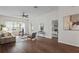 Spacious living room with hardwood floors, contemporary furnishings, and plenty of natural light at 2616 Tottenham Dr, New Port Richey, FL 34655