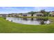 Picturesque pond view, lush landscaping, and charming fountain complete the neighborhood scenery at 2616 Tottenham Dr, New Port Richey, FL 34655