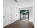 Bright hallway featuring a sliding glass door to the backyard and closet at 29595 Fedora Cir, Brooksville, FL 34602
