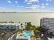 Aerial view of the community's pool, surrounded by lounge chairs and tropical landscaping near the waterway at 2960 59Th S St # 303, Gulfport, FL 33707