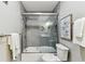 Bathroom featuring gray tile, walk-in shower with glass doors, and modern vanity at 2960 59Th S St # 303, Gulfport, FL 33707