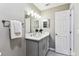 Well-lit bathroom with a gray vanity, stylish fixtures, and a convenient towel rack for a relaxing atmosphere at 2960 59Th S St # 303, Gulfport, FL 33707