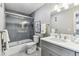 Bathroom featuring gray tile, walk-in shower with glass doors, and modern vanity at 2960 59Th S St # 303, Gulfport, FL 33707