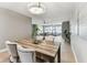 A spacious dining area, offering a view to the living room with a ceiling fan at 2960 59Th S St # 303, Gulfport, FL 33707