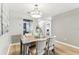 Cozy dining room featuring a modern light fixture and seating for four at 2960 59Th S St # 303, Gulfport, FL 33707