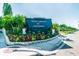 Entrance sign for Town Shores of Gulfport, enhanced with colorful landscaping and well-kept grounds at 2960 59Th S St # 303, Gulfport, FL 33707