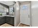 Inviting entryway with stylish flooring, gray cabinets, and a view into the bright kitchen, offering a warm welcome at 2960 59Th S St # 303, Gulfport, FL 33707