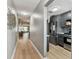 Bright hallway showcasing modern kitchen with stainless steel appliances at 2960 59Th S St # 303, Gulfport, FL 33707
