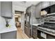 A modern kitchen with stainless steel refrigerator adjacent to the dining room at 2960 59Th S St # 303, Gulfport, FL 33707