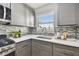 Updated kitchen with gray cabinets, stainless steel appliances, and bright countertops at 2960 59Th S St # 303, Gulfport, FL 33707