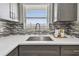 Close-up of the kitchen sink area, featuring modern faucet and bright countertop at 2960 59Th S St # 303, Gulfport, FL 33707