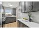 Updated kitchen with gray cabinets and stainless steel appliances at 2960 59Th S St # 303, Gulfport, FL 33707