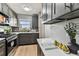 Bright kitchen featuring modern gray cabinets and stainless steel appliances at 2960 59Th S St # 303, Gulfport, FL 33707